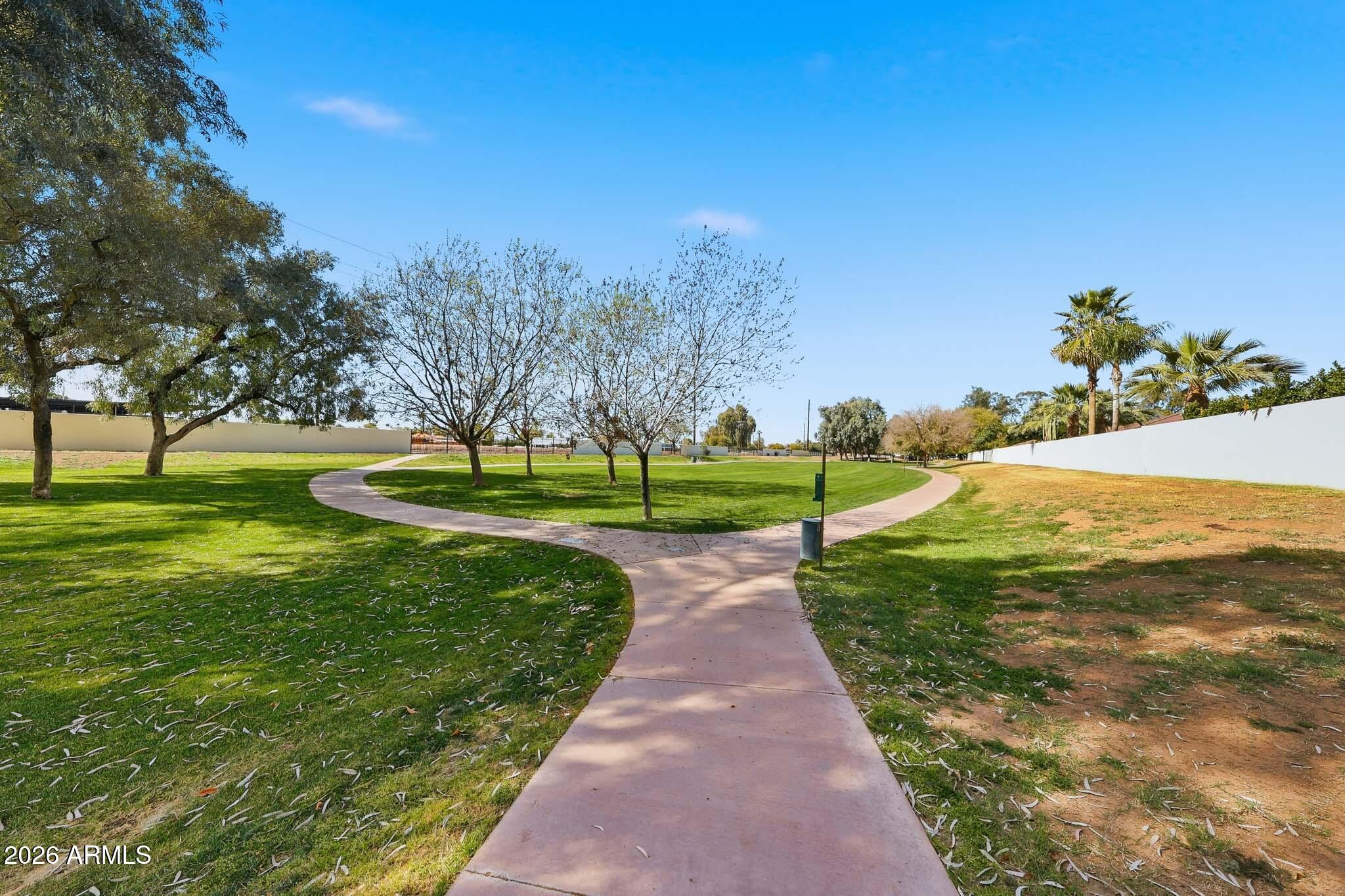 4149 North 49th Way Phoenix, AZ 85018 - Photo 18 of 25 a view of a garden with a building in the background