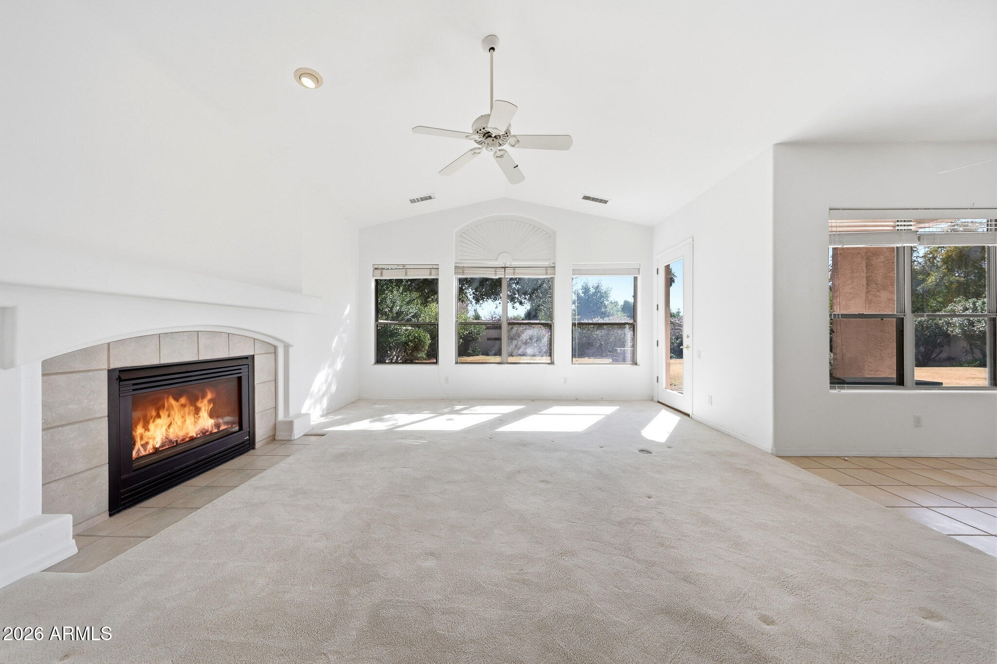 4149 North 49th Way Phoenix, AZ 85018 - Photo 3 of 25 a view of an empty room with a fireplace