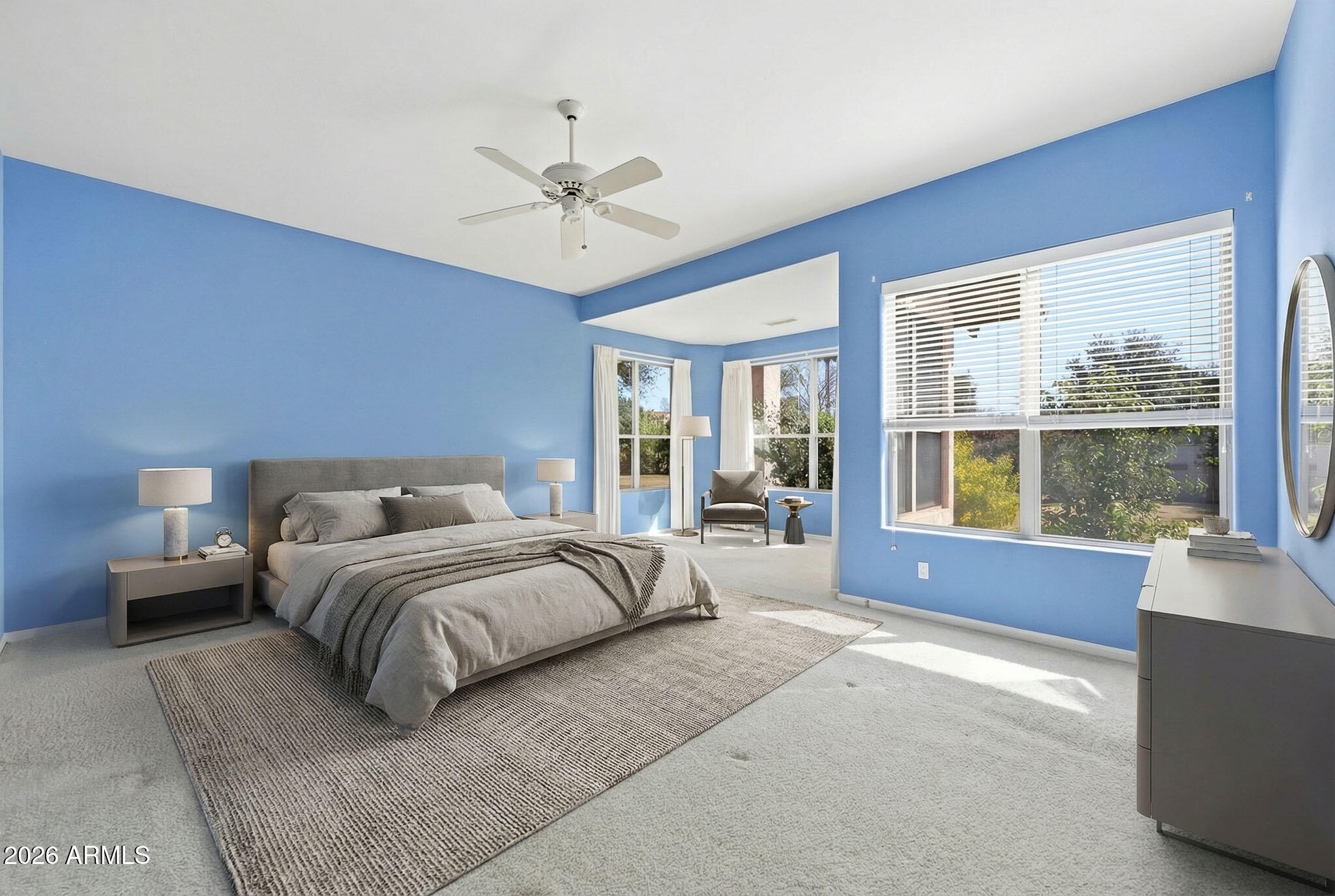 4149 North 49th Way Phoenix, AZ 85018 - Photo 9 of 25 a spacious bedroom with a large bed and a large window