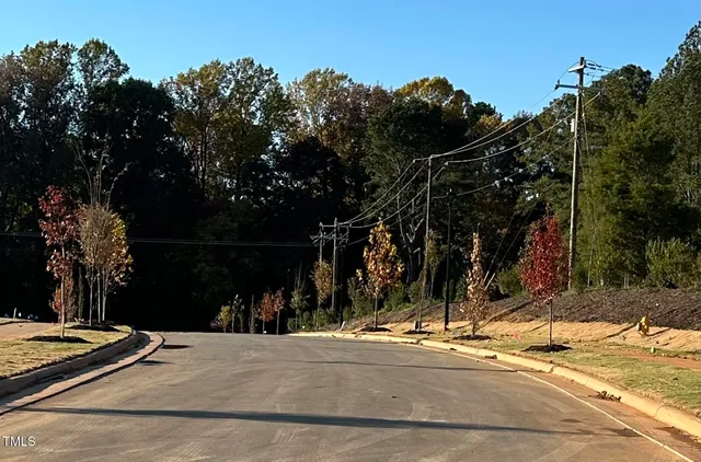 a view of a street with sitting area