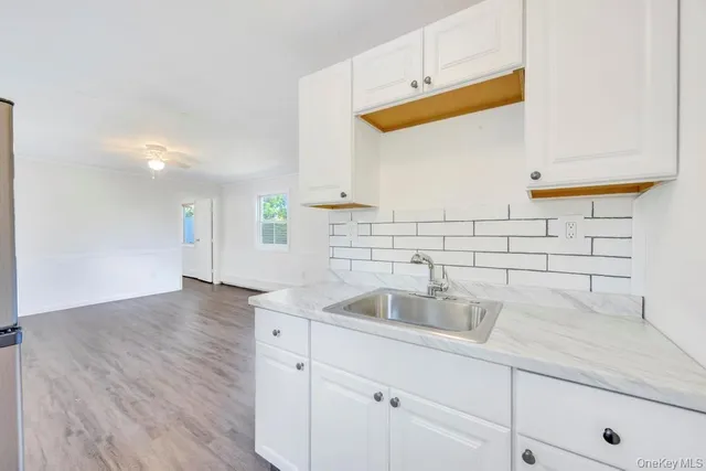 a kitchen with a sink and cabinets