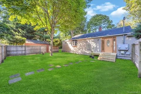 a backyard of a house with seating space