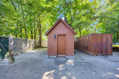 a view of a park with large trees