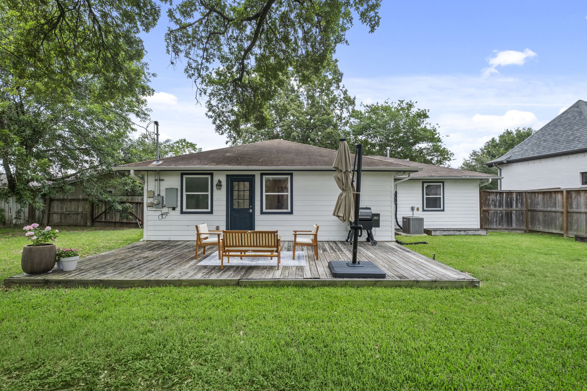 4733 Carleen Road Houston, TX 77092 - Photo 20 of 22 The expansive deck creates an easy extension of the indoor living spaces, perfect for quiet mornings, casual dinners, or gathering with friends under the trees.