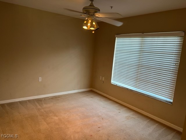 9440 Ivy Brook Run, Unit 509 Fort Myers, FL 33913 - Photo 12 of 17 a view of an empty room with a window