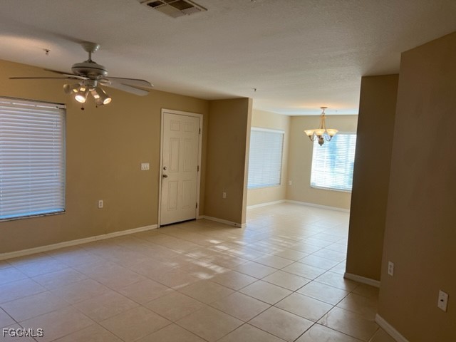 9440 Ivy Brook Run, Unit 509 Fort Myers, FL 33913 - Photo 14 of 17 an empty room with windows and fan
