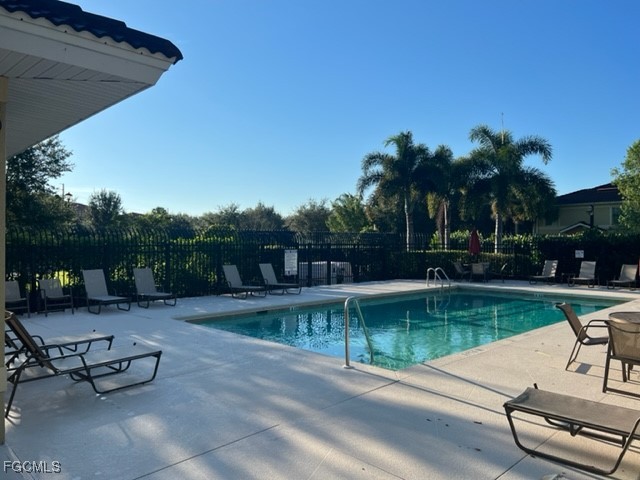 9440 Ivy Brook Run, Unit 509 Fort Myers, FL 33913 - Photo 15 of 17 a view of a swimming pool with a patio