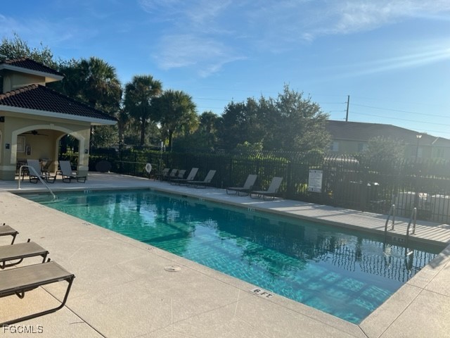 9440 Ivy Brook Run, Unit 509 Fort Myers, FL 33913 - Photo 16 of 17 a view of a water pond with green yard