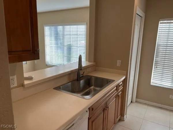 a kitchen that has a sink and a stove
