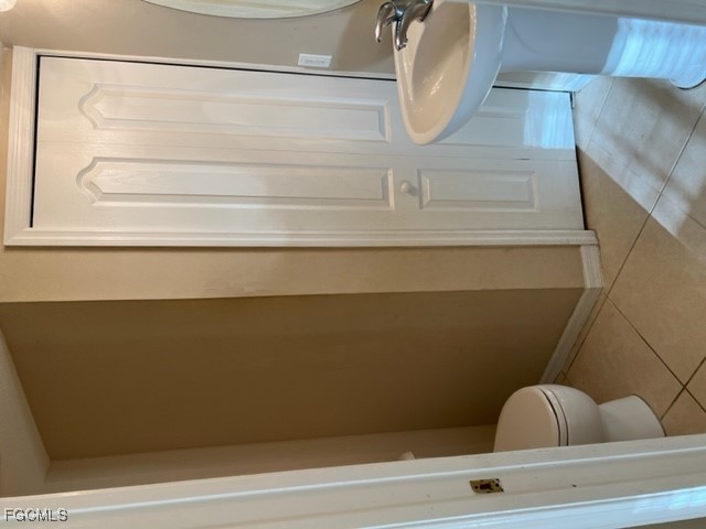 9440 Ivy Brook Run, Unit 509 Fort Myers, FL 33913 - Photo 7 of 17 a view of staircase with white walls and railing