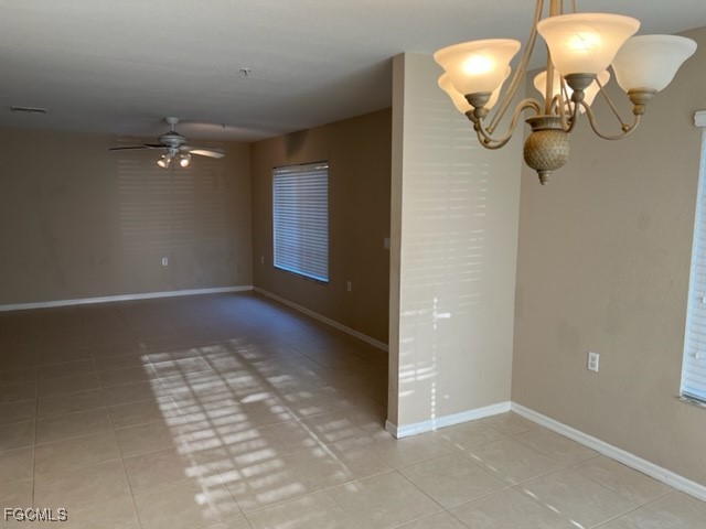 9440 Ivy Brook Run, Unit 509 Fort Myers, FL 33913 - Photo 8 of 17 an empty room with windows and fan