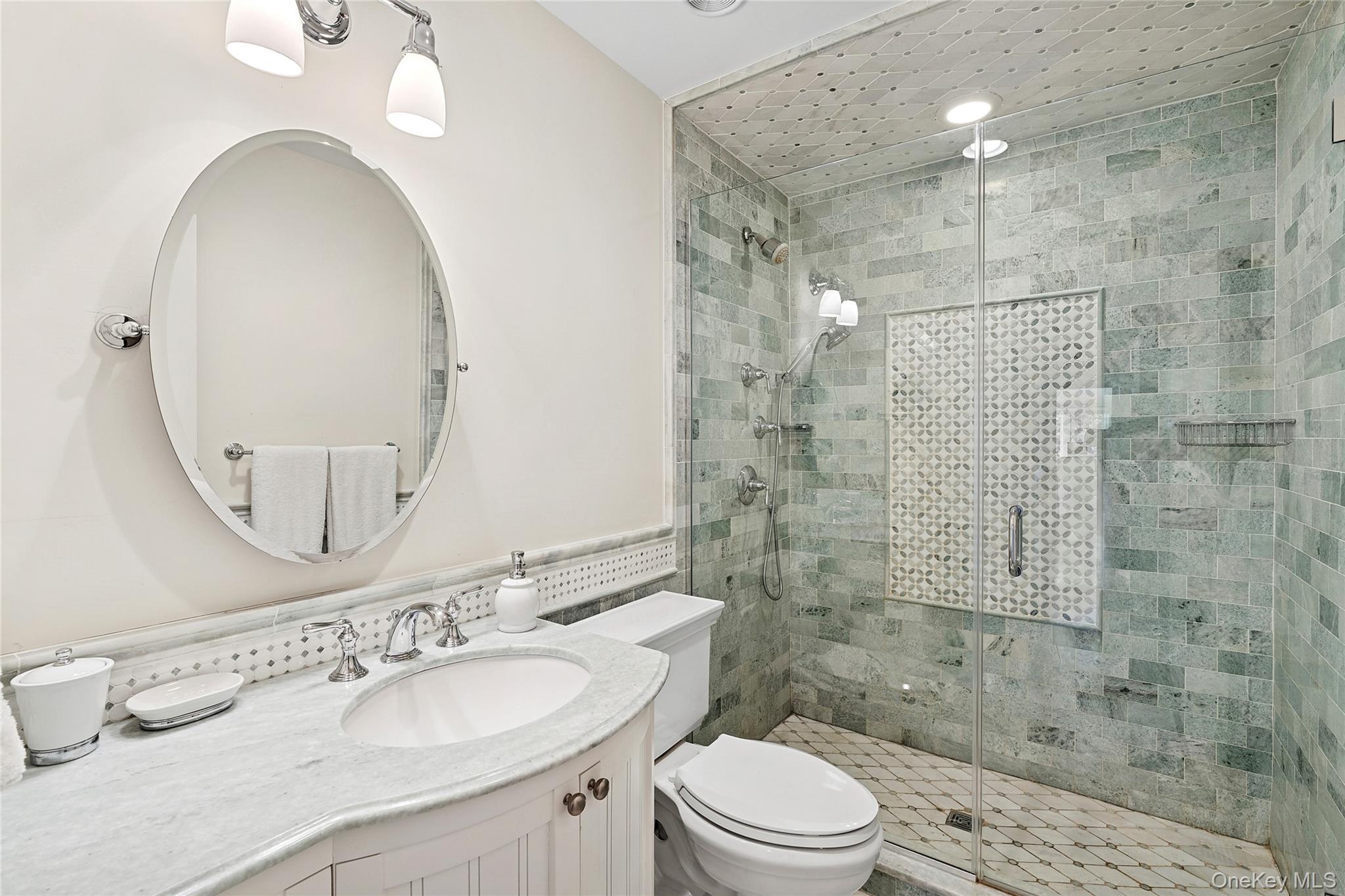 8 East Ridge Court Westhampton, NY 11977 - Photo 23 of 32 a bathroom with a sink a toilet and shower