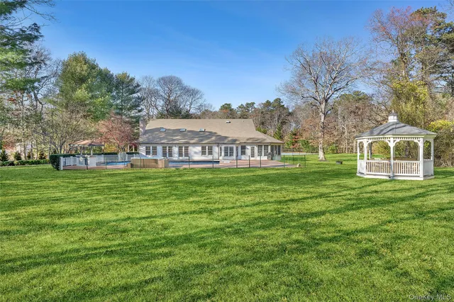 a view of a house with a big yard