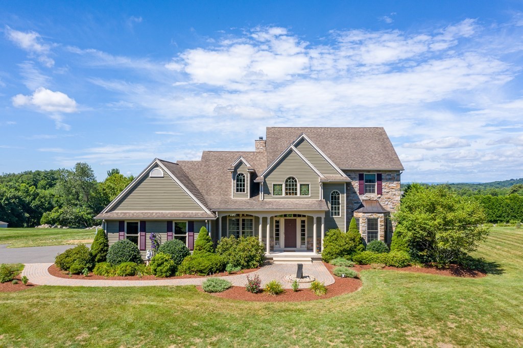 290 Three Rivers Road Wilbraham, MA 01095 - Photo 1 of 42 a front view of a house with a yard