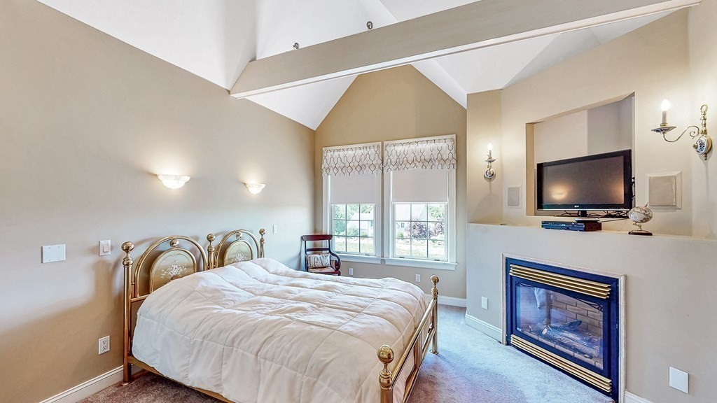 290 Three Rivers Road Wilbraham, MA 01095 - Photo 18 of 42 a bedroom with a bed and a flat screen tv