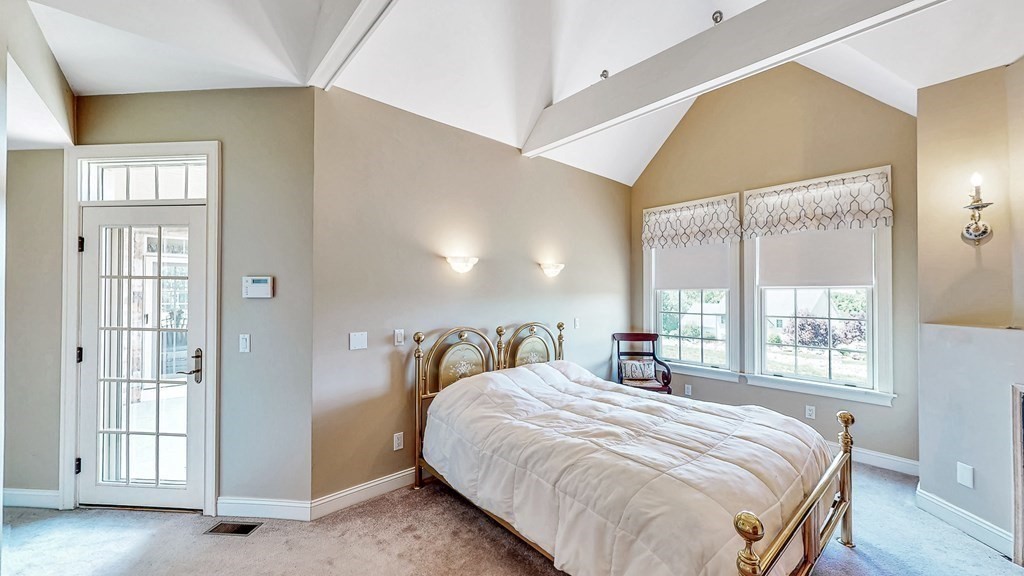 290 Three Rivers Road Wilbraham, MA 01095 - Photo 19 of 42 a bedroom with a large bed and a large window