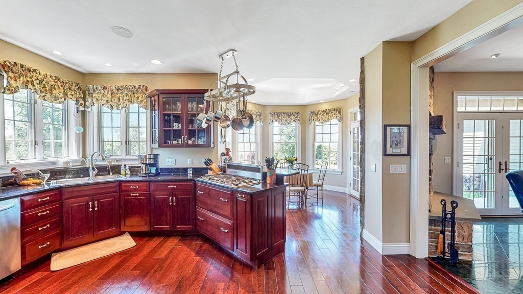 290 Three Rivers Road Wilbraham, MA 01095 - Photo 7 of 42 a large kitchen with cabinets chairs and wooden floor