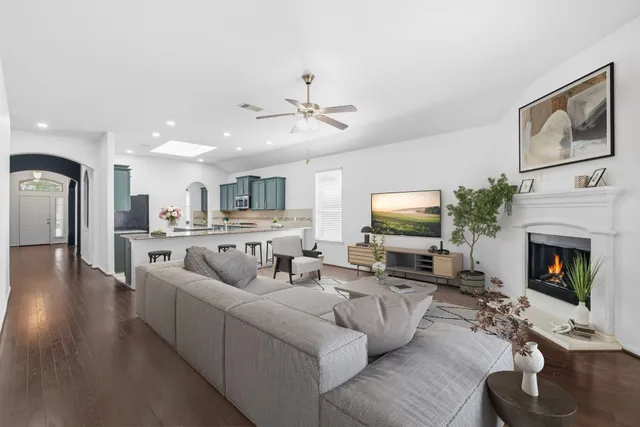 a living room with furniture fireplace and a flat screen tv