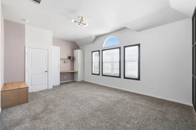a large bathroom with a large mirror vanity and shower