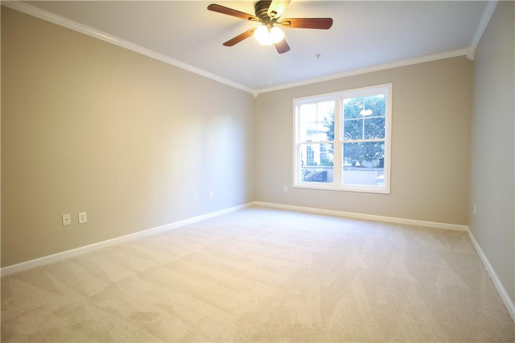 225 East Ponce De Leon Avenue, Unit 325 Decatur, GA 30030 - Photo 13 of 34 an empty room with windows and fan