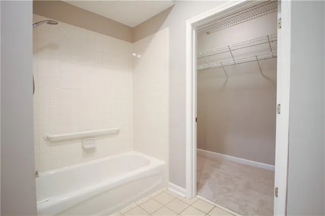 a white bench sitting in front of a building