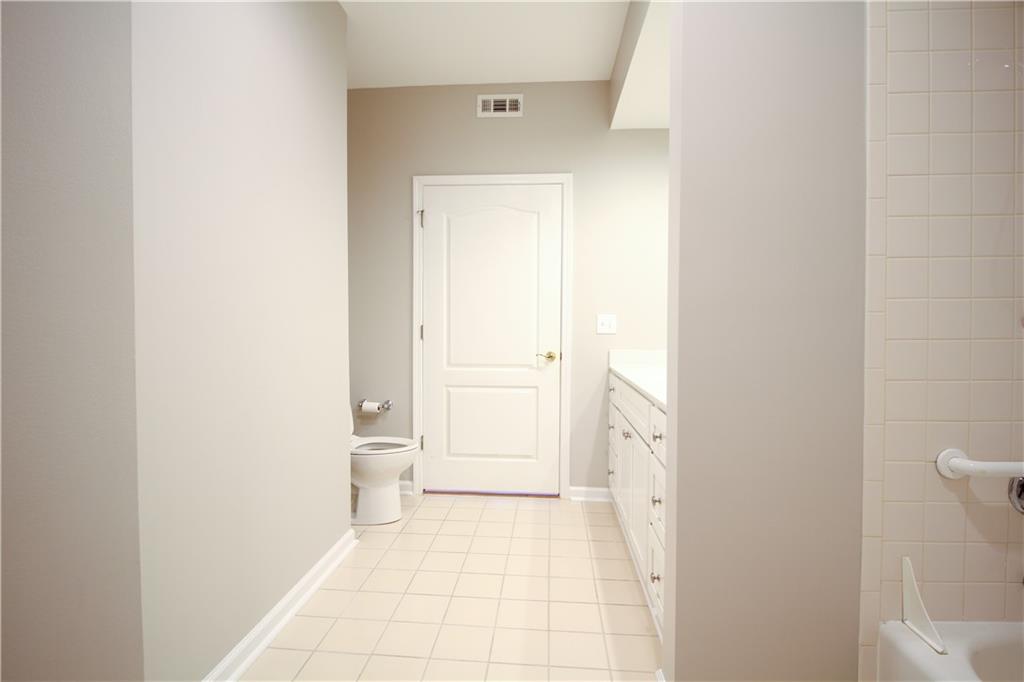 225 East Ponce De Leon Avenue, Unit 325 Decatur, GA 30030 - Photo 17 of 35 a bathroom with a toilet