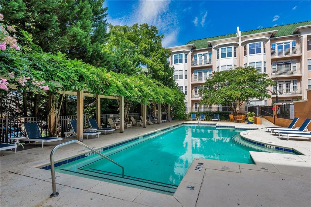 225 East Ponce De Leon Avenue, Unit 325 Decatur, GA 30030 - Photo 18 of 34 a view of a house with swimming pool and sitting area