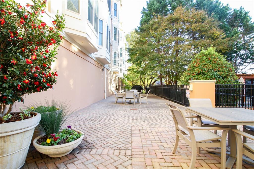 225 East Ponce De Leon Avenue, Unit 325 Decatur, GA 30030 - Photo 20 of 35 a white bench sitting in front of a building