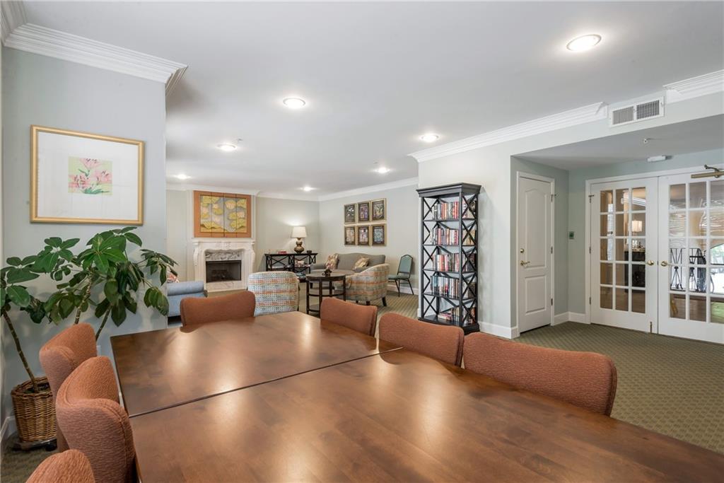 225 East Ponce De Leon Avenue, Unit 325 Decatur, GA 30030 - Photo 23 of 35 a living room with furniture potted plant and paintings on the wall