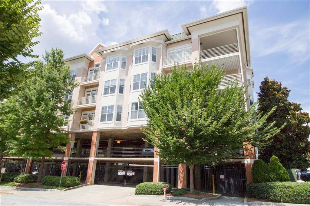 225 East Ponce De Leon Avenue, Unit 325 Decatur, GA 30030 - Photo 28 of 35 a front view of a building with garden