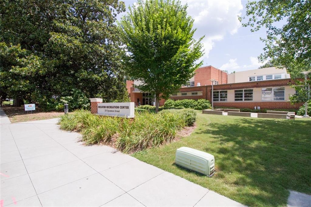 225 East Ponce De Leon Avenue, Unit 325 Decatur, GA 30030 - Photo 29 of 35 a front view of a house with a garden