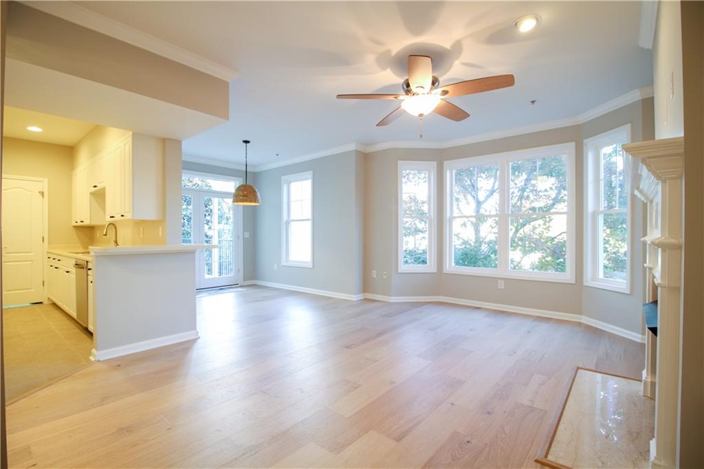 225 East Ponce De Leon Avenue, Unit 325 Decatur, GA 30030 - Photo 3 of 35 a view of a livingroom with a ceiling fan and window