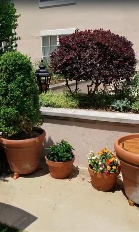 225 East Ponce De Leon Avenue, Unit 325 Decatur, GA 30030 - Photo 33 of 34 a view of a back yard of the patio and a fountain