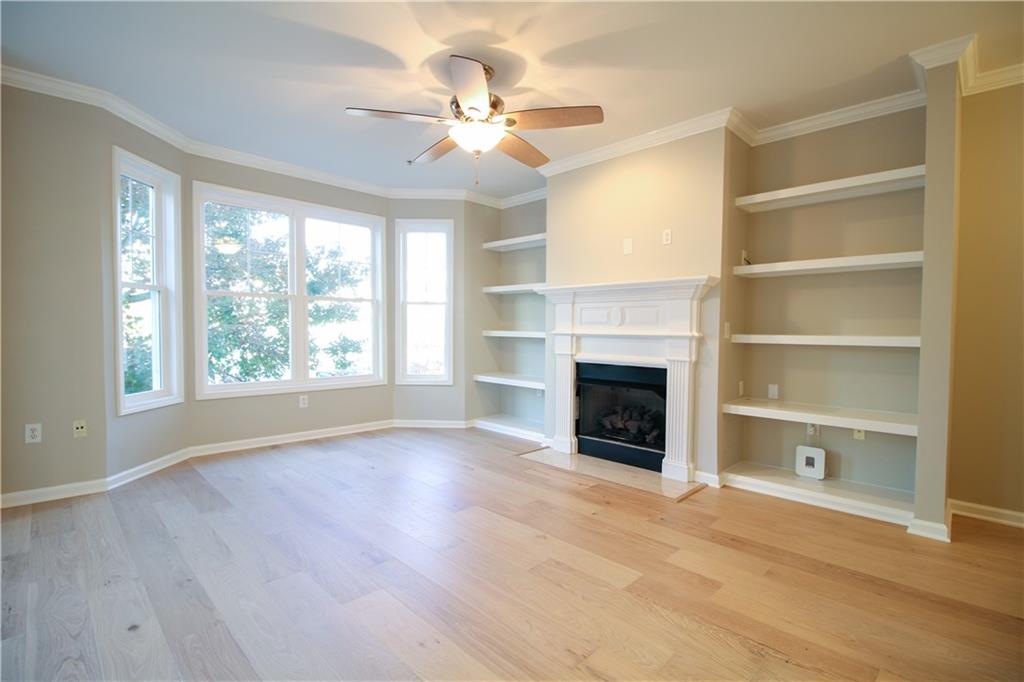 225 East Ponce De Leon Avenue, Unit 325 Decatur, GA 30030 - Photo 4 of 34 a view of an empty room with a fireplace and a window