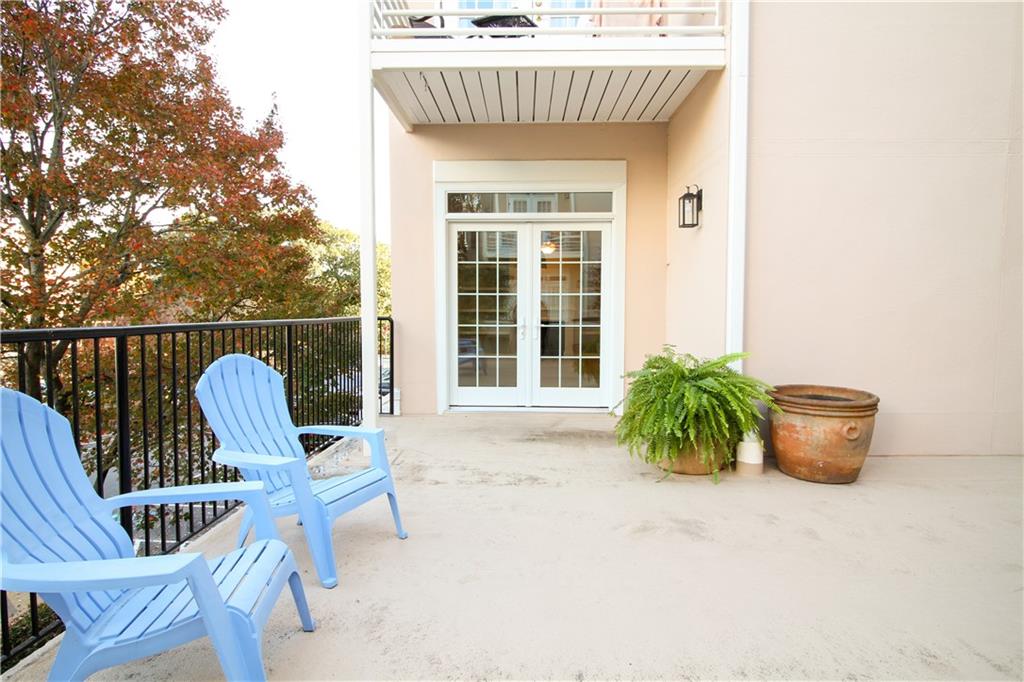 225 East Ponce De Leon Avenue, Unit 325 Decatur, GA 30030 - Photo 9 of 35 a view of a chair and table in the terrace