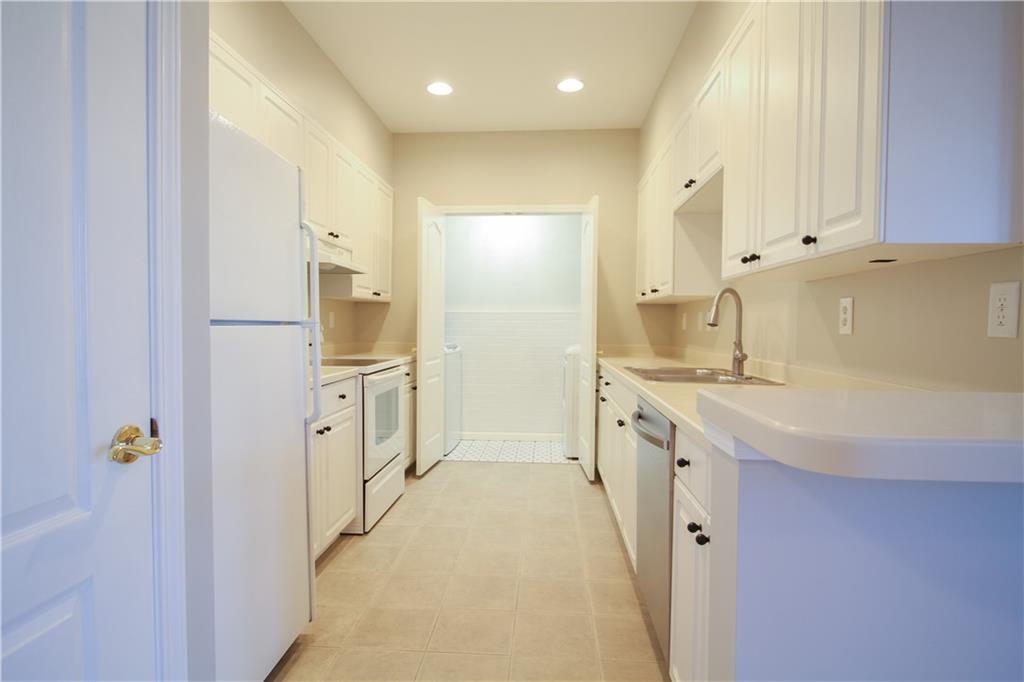 225 East Ponce De Leon Avenue, Unit 325 Decatur, GA 30030 - Photo 10 of 34 a spacious bathroom with a double vanity sink a mirror and a shower