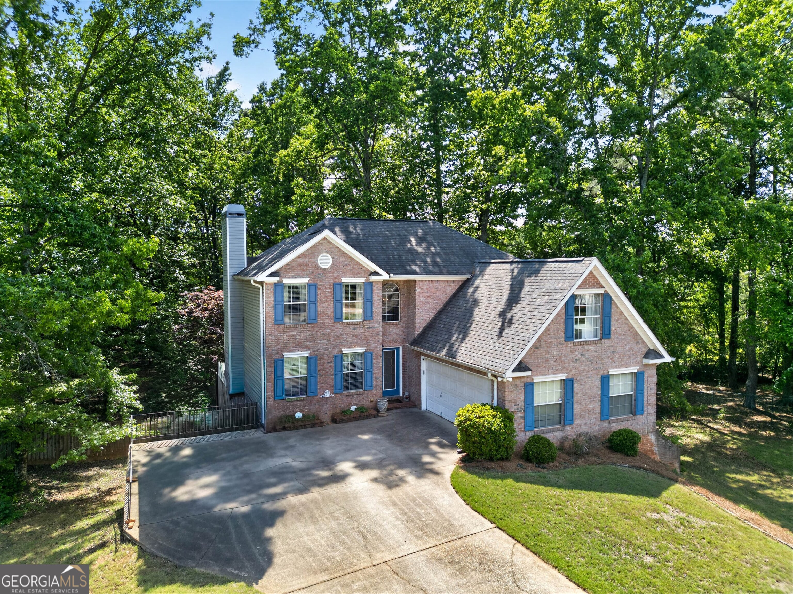 101 Emerald Lane Hampton, GA 30228 - Photo 61 of 72 a front view of a house with a yard and garage