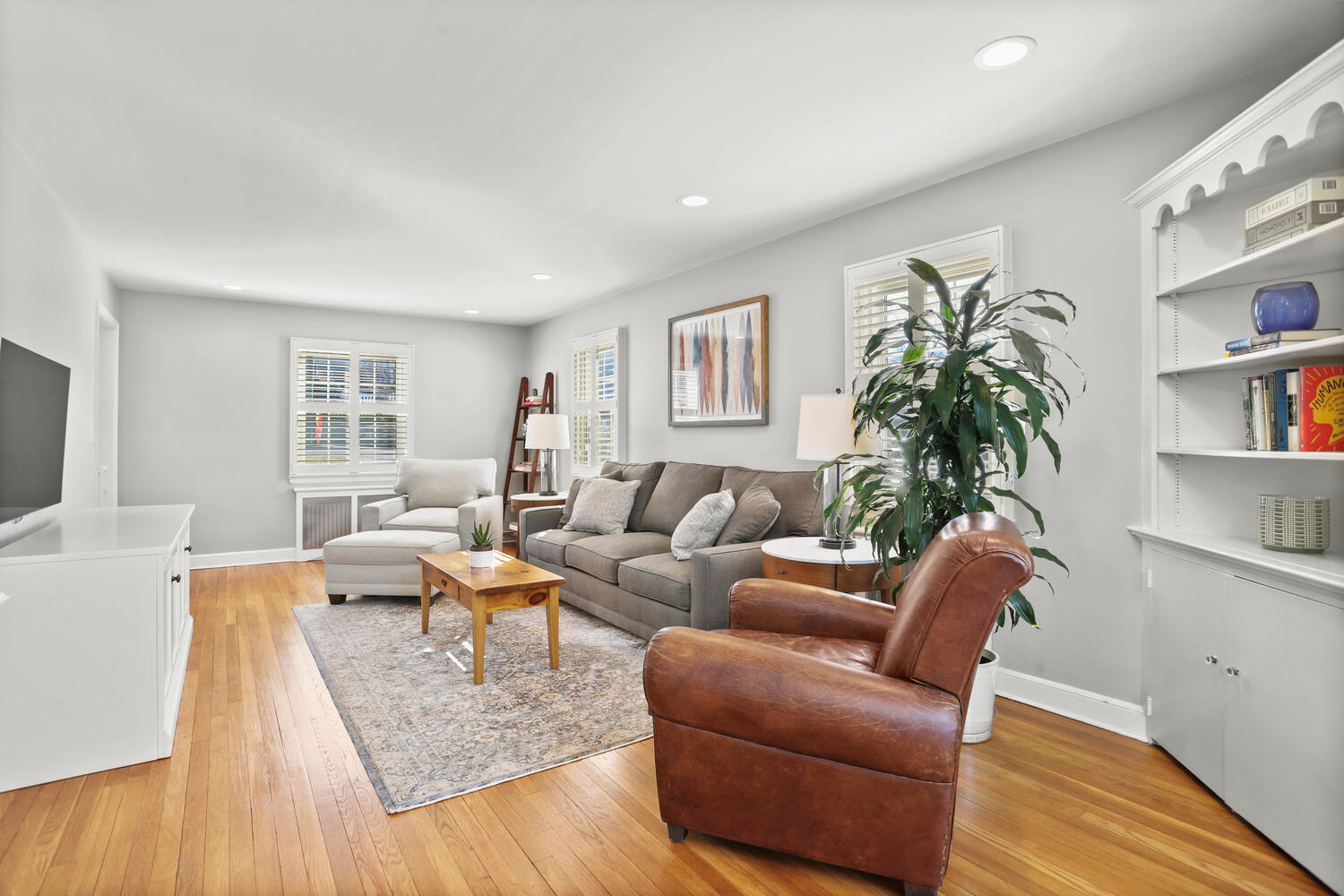 197 Hollow Tree Ridge Road Darien, CT 06820 - Photo 3 of 24 a living room with furniture and a potted plant