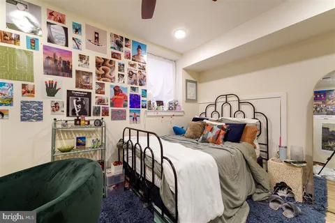 a bedroom with furniture and a baby crib