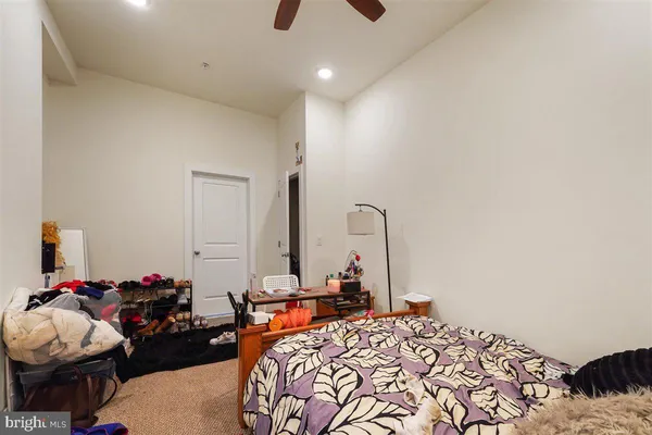 a bedroom with furniture and a chandelier