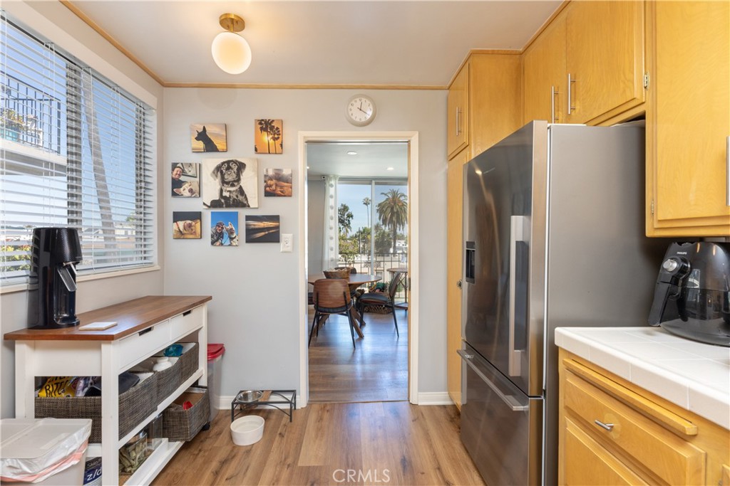 2772 2nd Street, Unit 2G Long Beach, CA 90803 - Photo 15 of 53 a kitchen with stainless steel appliances granite countertop a refrigerator and a stove