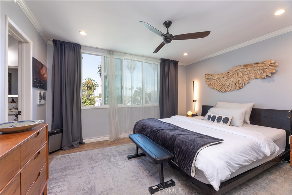 2772 2nd Street, Unit 2G Long Beach, CA 90803 - Photo 21 of 53 a bedroom with a bed dresser and a window