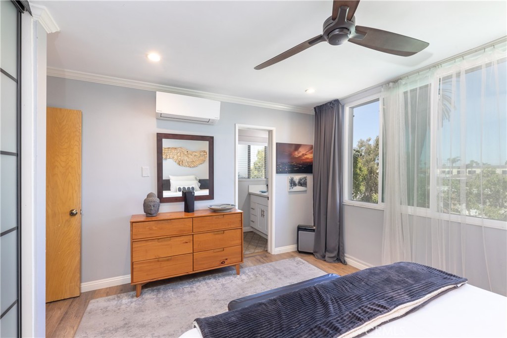 2772 2nd Street, Unit 2G Long Beach, CA 90803 - Photo 22 of 53 a bedroom with a bed and large windows