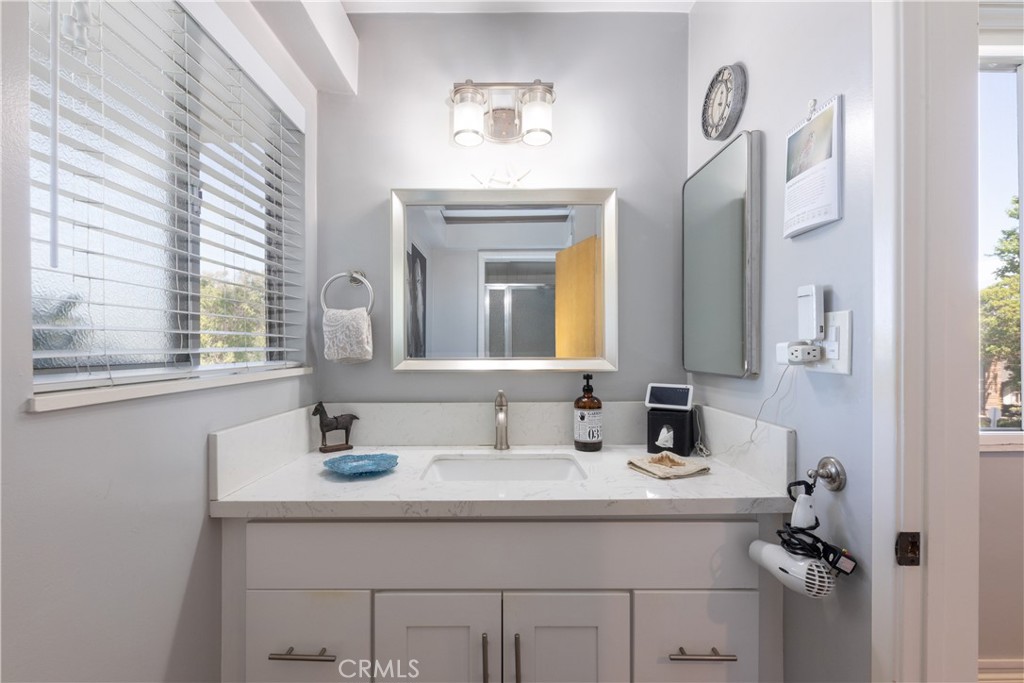 2772 2nd Street, Unit 2G Long Beach, CA 90803 - Photo 25 of 53 a bathroom with a sink and a mirror