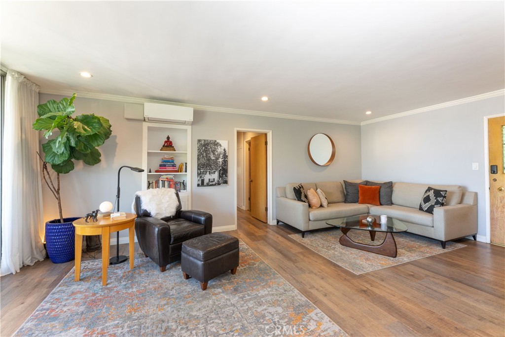 2772 2nd Street, Unit 2G Long Beach, CA 90803 - Photo 8 of 53 a living room with furniture a rug potted plant and a window