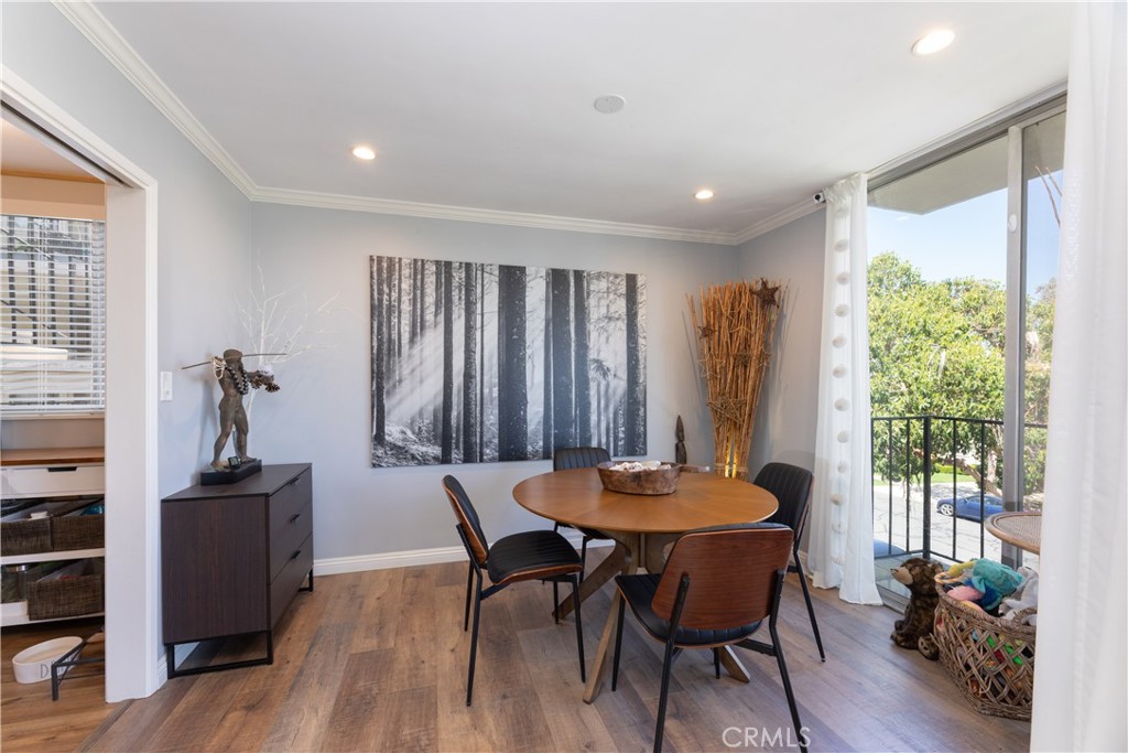 2772 2nd Street, Unit 2G Long Beach, CA 90803 - Photo 9 of 53 a view of a dining room with furniture window and wooden floor