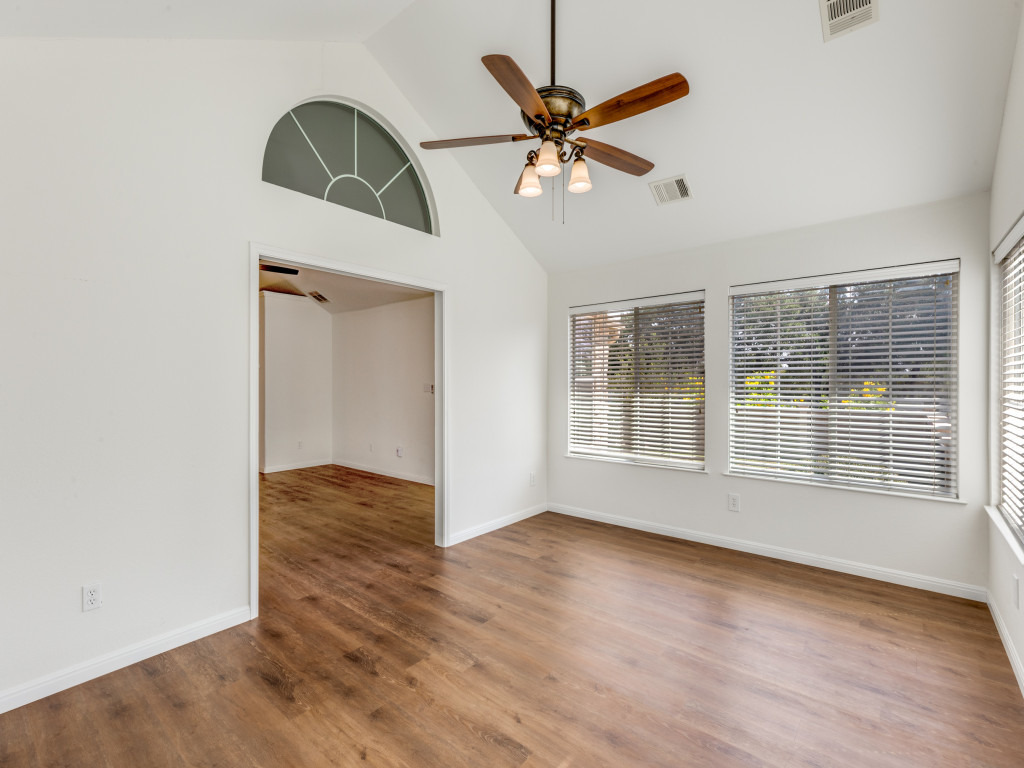 30 Wildwood Drive, Unit 174 Georgetown, TX 78633 - Photo 20 of 34 a view of an empty room with wooden floor and a window