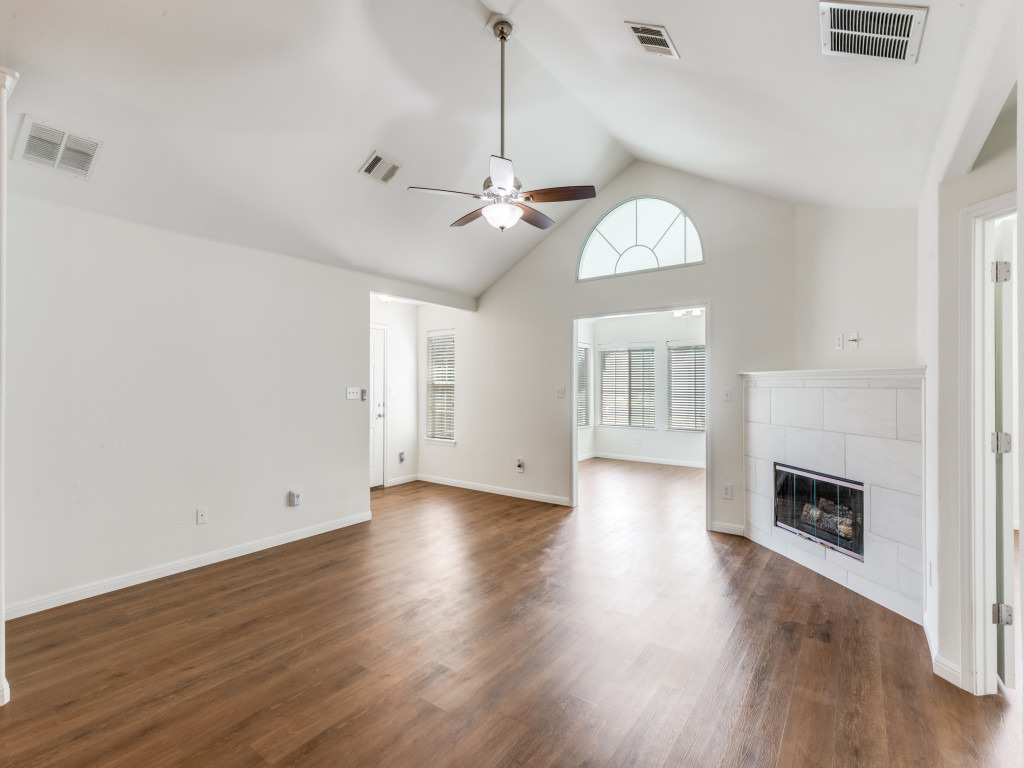 30 Wildwood Drive, Unit 174 Georgetown, TX 78633 - Photo 2 of 34 a view of livingroom with fireplace wooden floor and window
