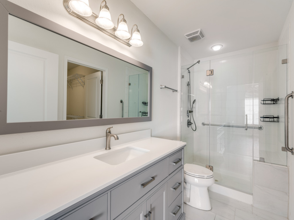 30 Wildwood Drive, Unit 174 Georgetown, TX 78633 - Photo 23 of 34 a bathroom with a sink a toilet and shower