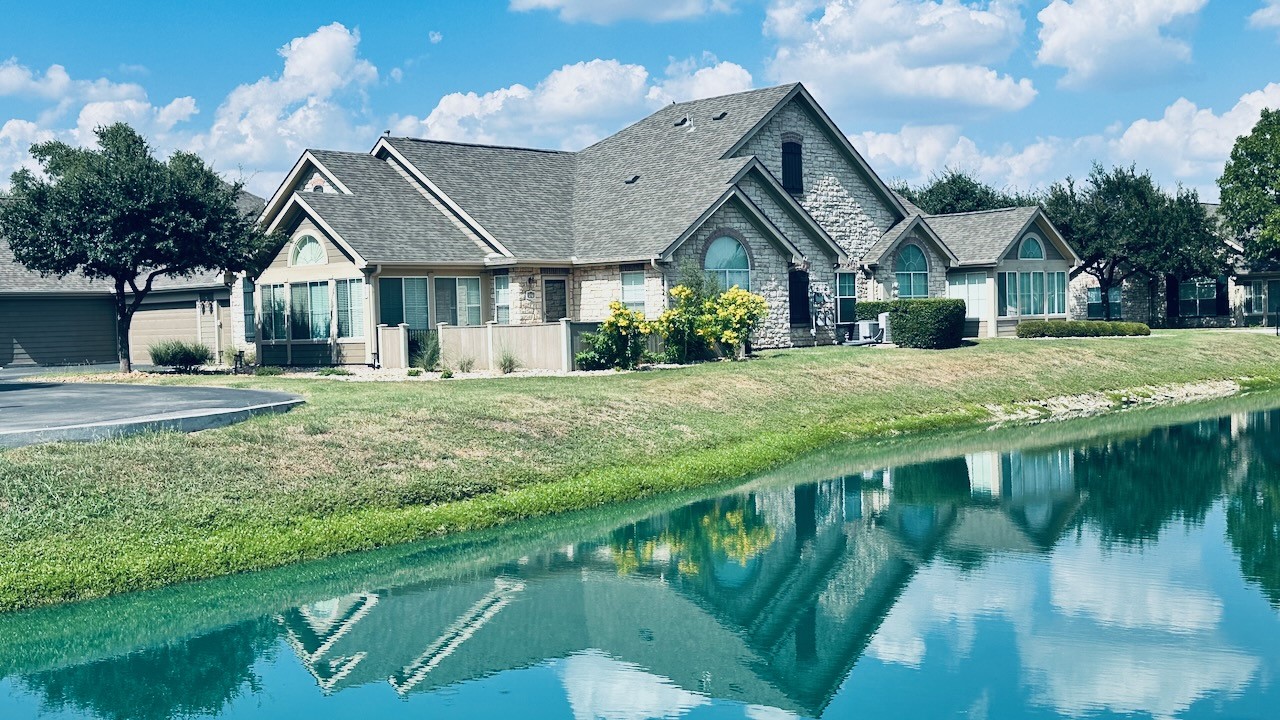 30 Wildwood Drive, Unit 174 Georgetown, TX 78633 - Photo 28 of 34 a front view of a house with a yard